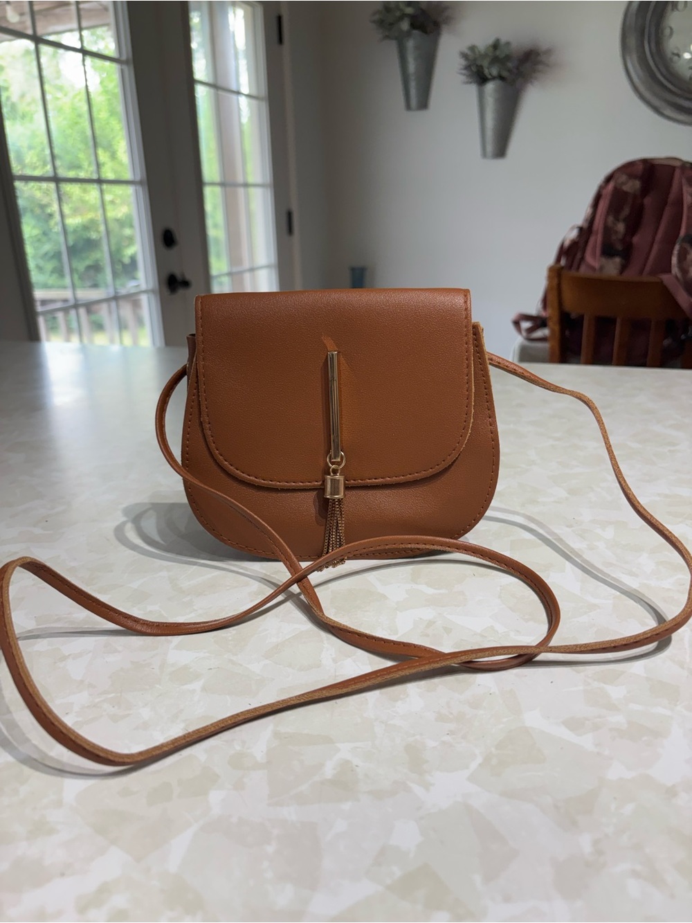 Sleek Brown Crossbody Bag with Tassel Detail
